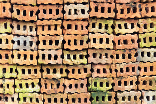 Old vintage colorful bricks stacked on floor. Abstract background.