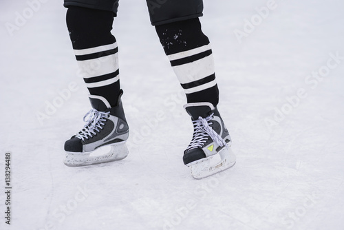 hockey skates close-up during a game on ice