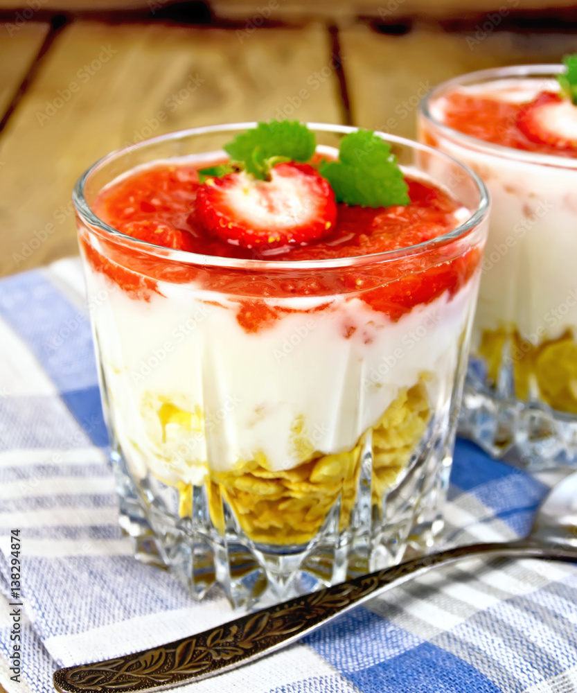 Dessert milk with strawberry in glassful on board and napkin Dessert milk with strawberry in glassful on board and napkin