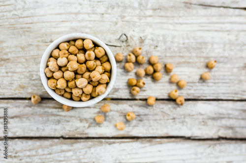 Superfood and healthy diet chickpeas on a wooden background. 