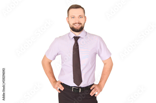 Handsome smart man posing with hand on hips