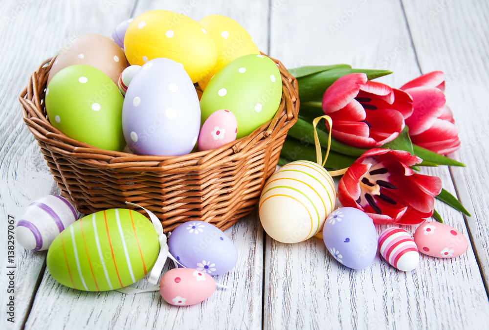 Fototapeta basket with easter eggs and tulips