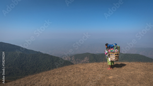 Fotografie Woman sherpa at the top of mountain, Doi Mon Jong, Thailand