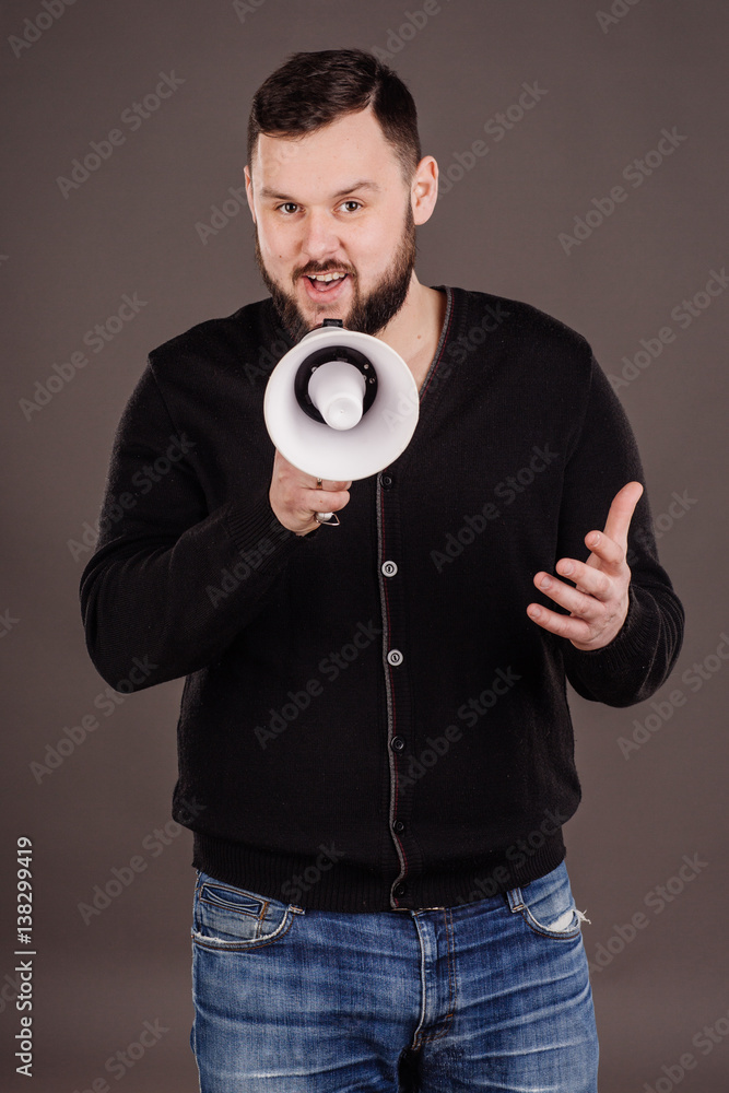 man holding megaphone. human emotion expression and lifestyle concept.