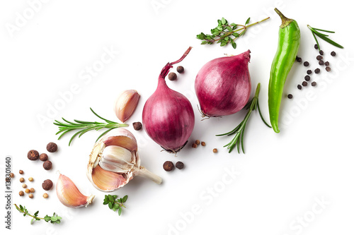 red onions and spices on white background
