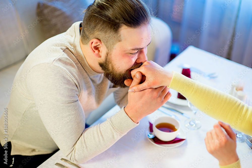 loving young couple drinking tea in the restaurant loving young couple drinking tea in the restaurant
