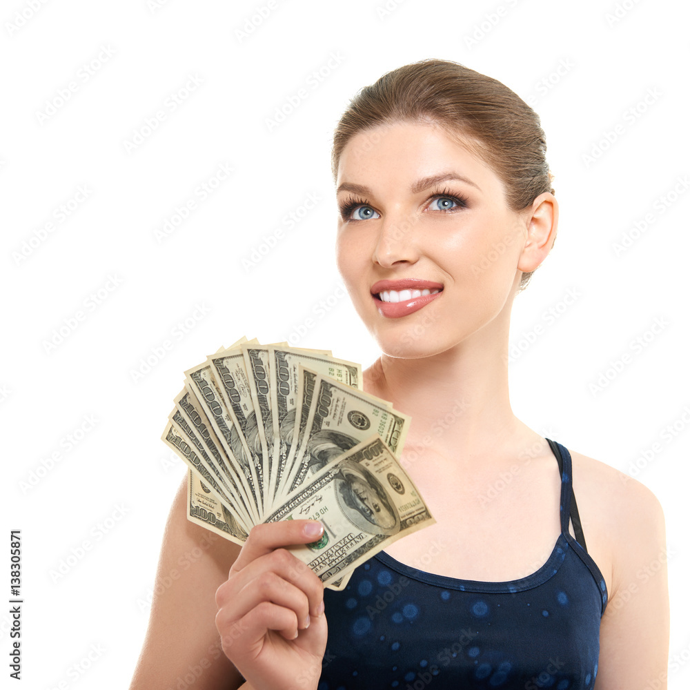 Young happy woman holding cash money dollars happy smiling and looking at copyspace in top left corner of picture, isolated on white background. Young happy woman holding cash money dollars happy smiling and looking at copyspace in top left corner of picture, isolated on white background.