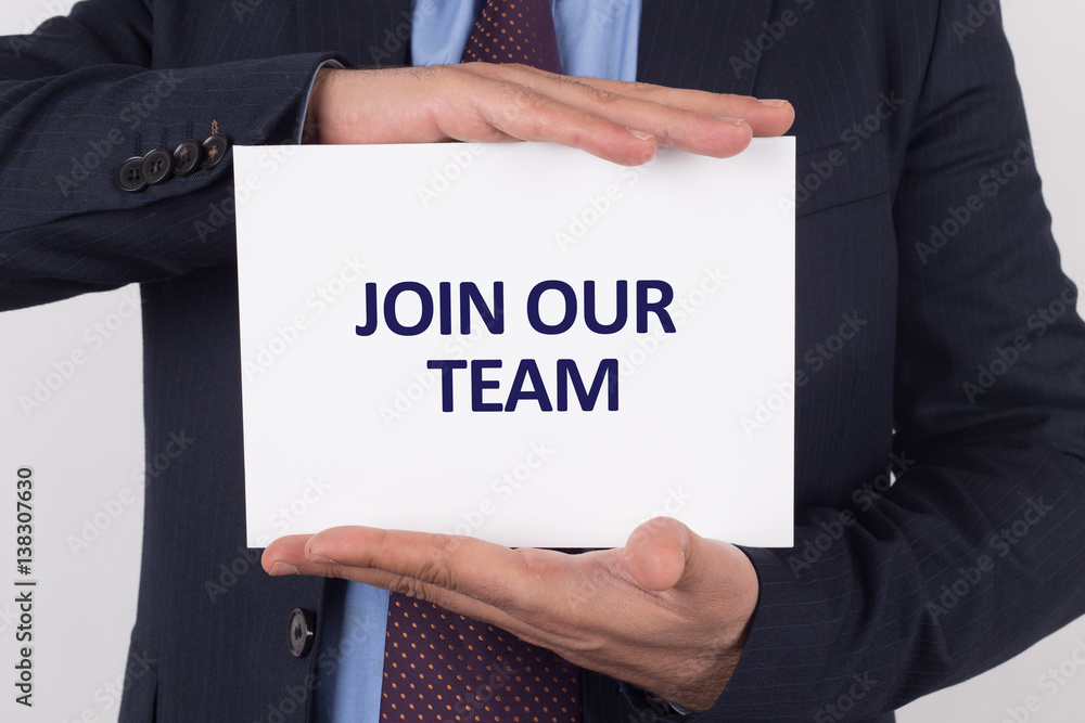 Man showing paper with JOIN OUR TEAM text Man showing paper with JOIN OUR TEAM text