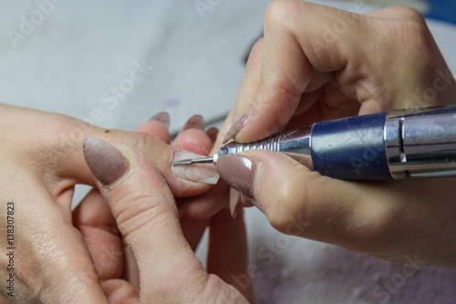 worker in nail salon