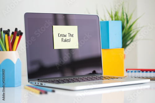 Know The Rules! sticky note pasted on the laptop photo