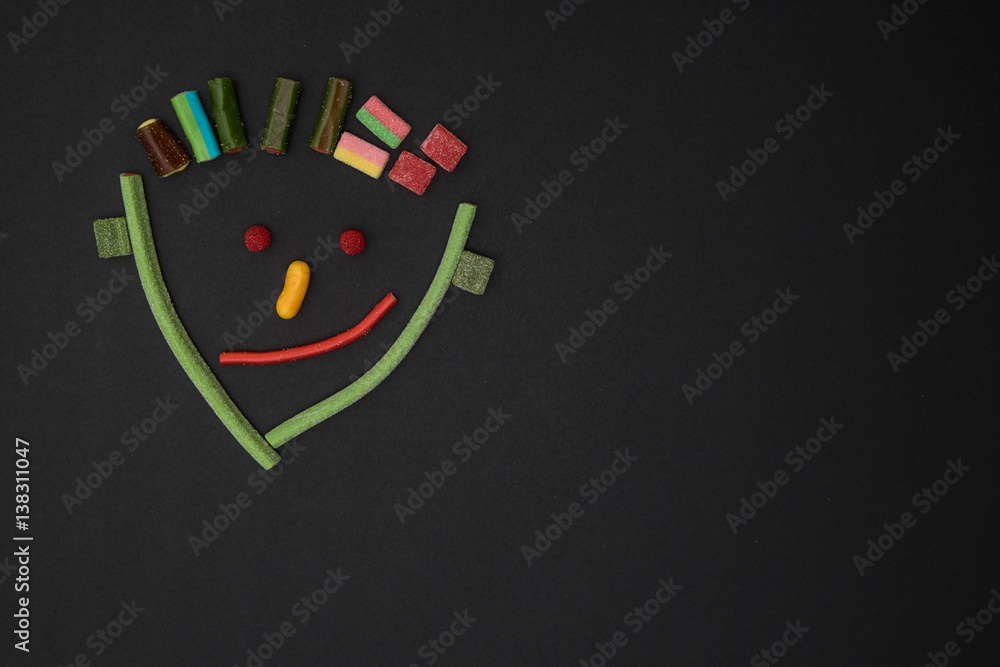 Obraz premium Funny face of a man made of sweets