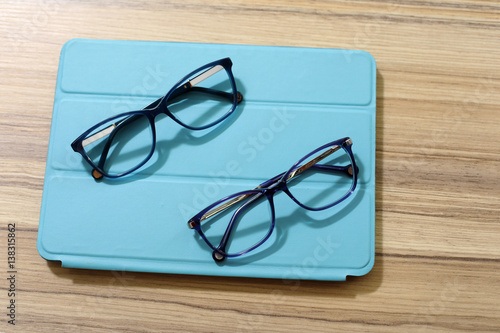  reading glasses on wooden background 