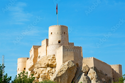 in oman muscat rock  the old defensive  fort battlesment sky and  star brick