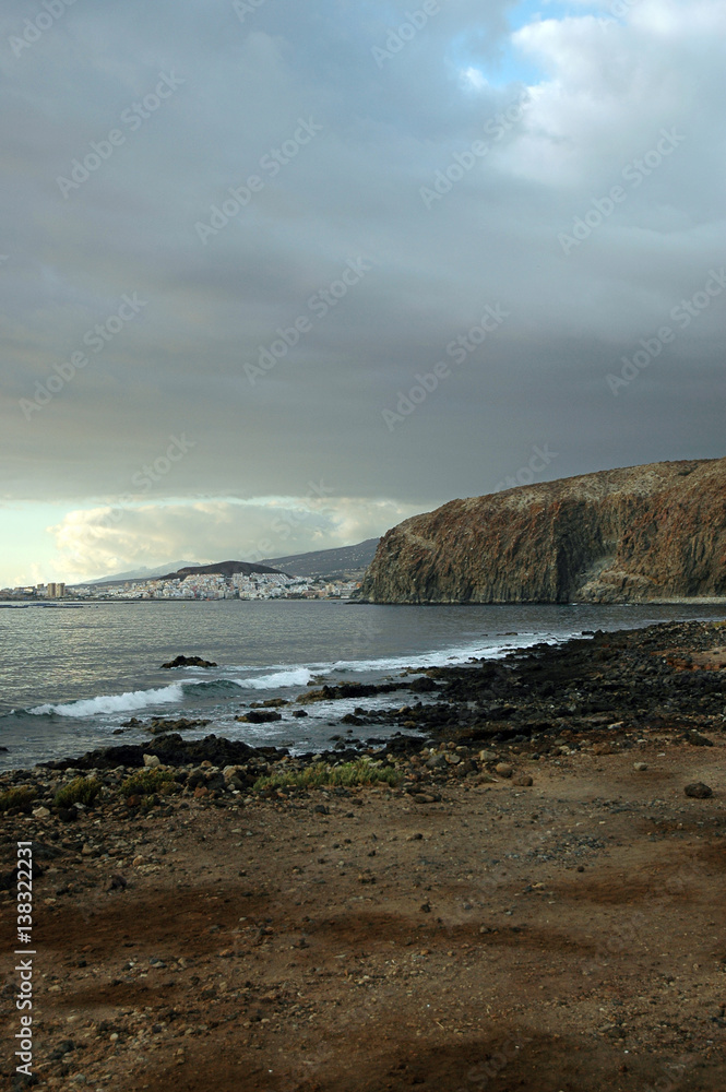 Sky cleaning after rain in Palm-Mar, with view towards Los Cristianos, Tenerife, Canary Islands