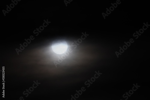 Full moon beautiful over dark black sky at have raincloud in night © pramot48