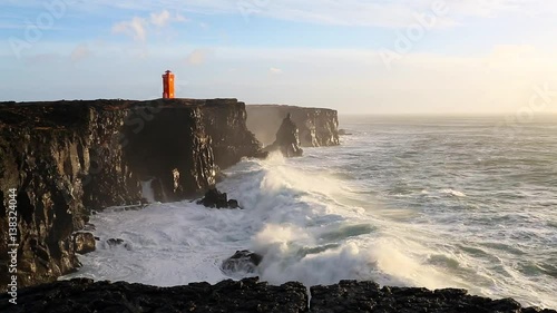 Waves breaking on the black rock cliff of western Icelandic coast, Snaefellsnes Peninsulain, Iceland