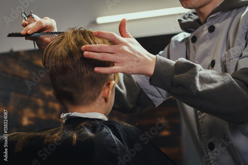 Little Boy Getting Haircut By Barber 