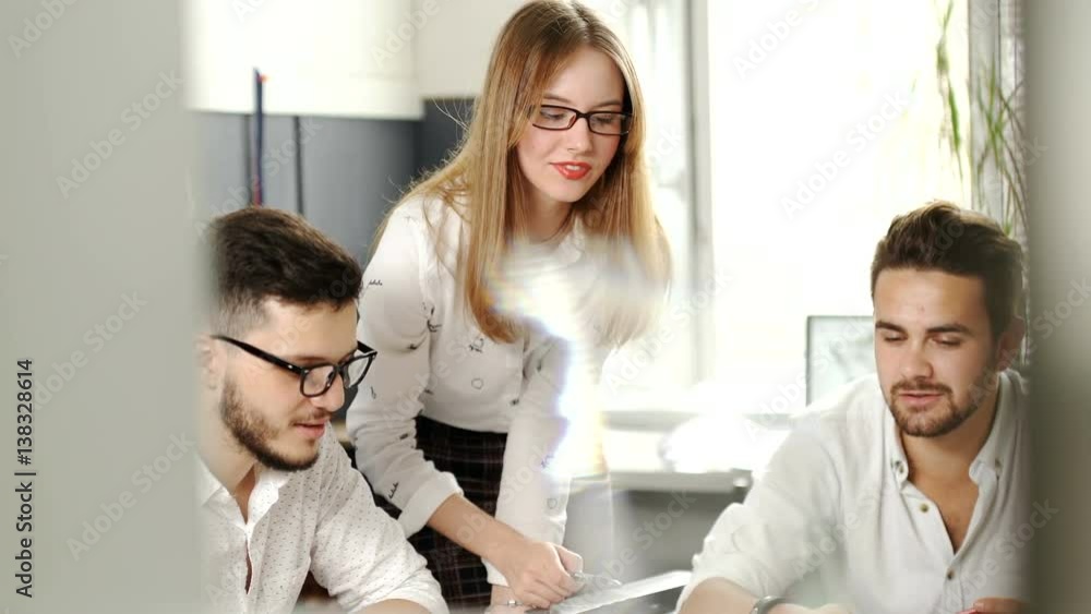 Three young creative designers working on project together. Team work. 20s. 4k. Three young creative designers working on project together. Team work. 20s. 4k.