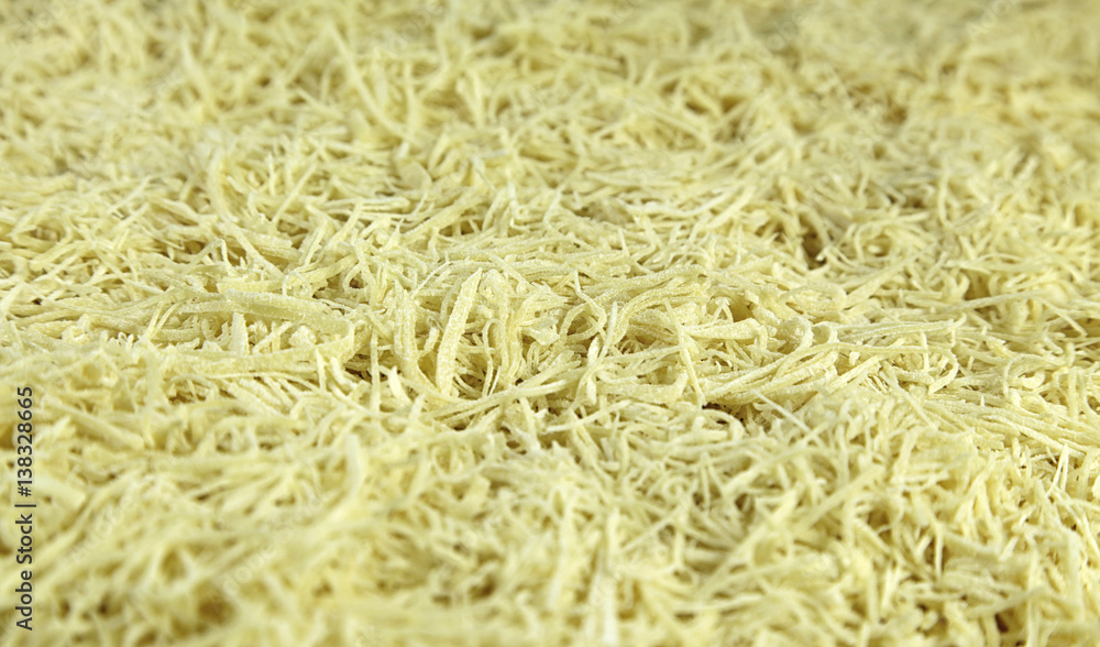Heap of yellow noodles close up background Heap of yellow noodles close up background