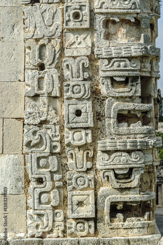 large masks of the Mayan god Chaac in the quadrangle of the nuns in the archaeological Uxmal enclosure in Yucatan, Mexico.