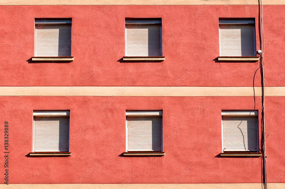 Fototapeta premium Facade of a building with six closed windows