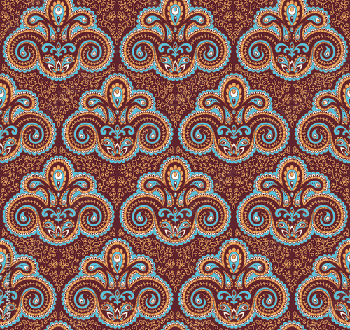 Vintage paisley seamless pattern. Ethnic ornament. Stylized decorative tribal painting. Traditional Indian, Turkey, oriental handcraft. Seamless texture in brown and light blue colors. Vector