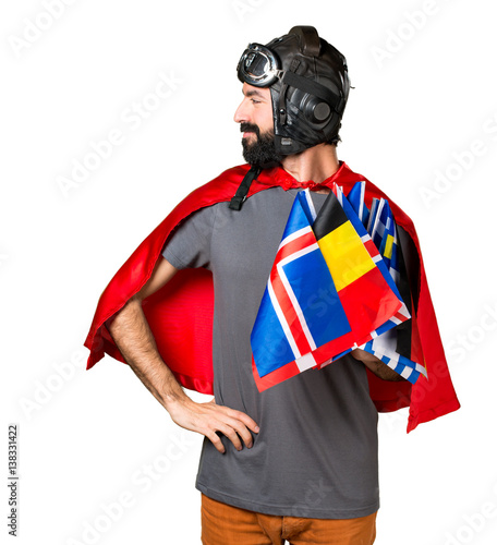 Superhero with a lot of flags looking lateral