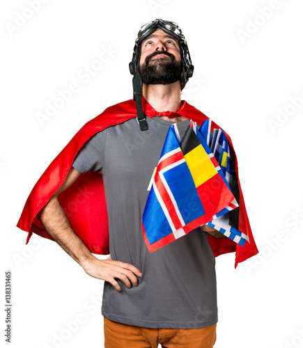 Superhero with a lot of flags looking up