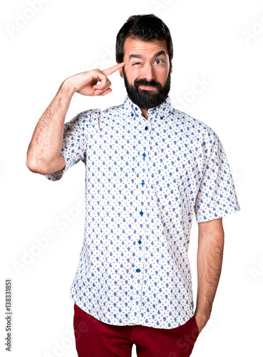 Handsome brunette man with beard making crazy gesture