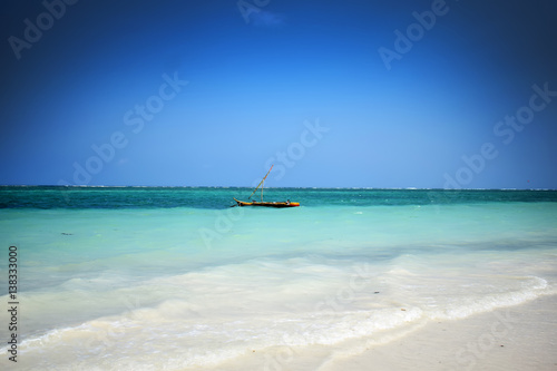 paradise beach with fishing boat © Dean
