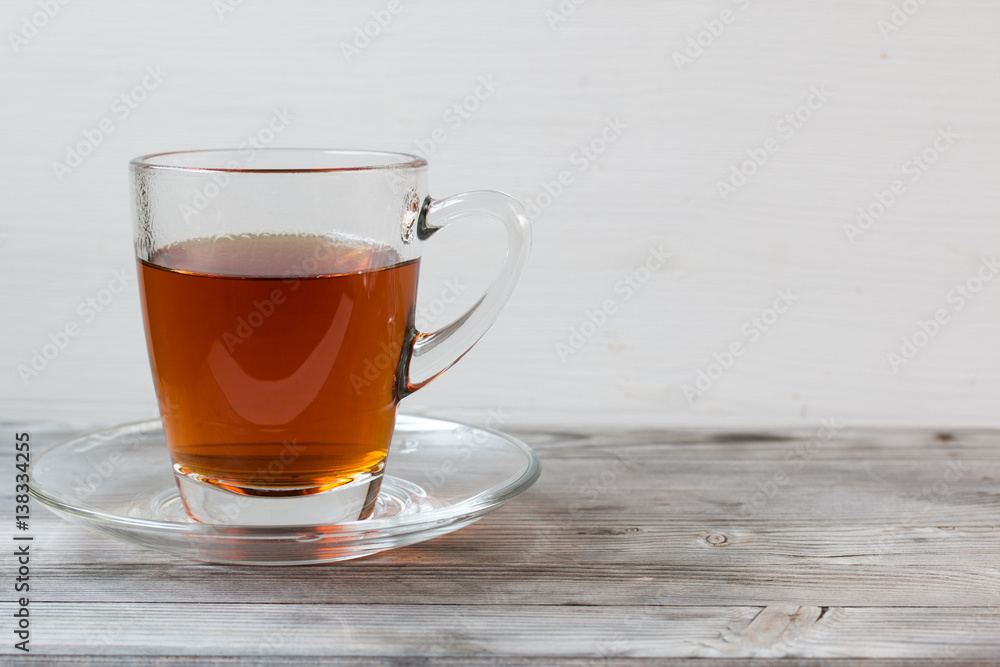 Black tea with mint. Grey wooden background. Black tea with mint. Grey wooden background.