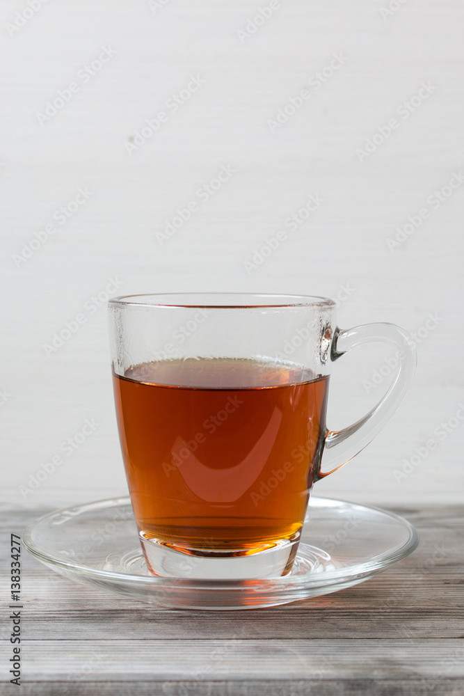 Black tea with mint. Grey wooden background. Black tea with mint. Grey wooden background.
