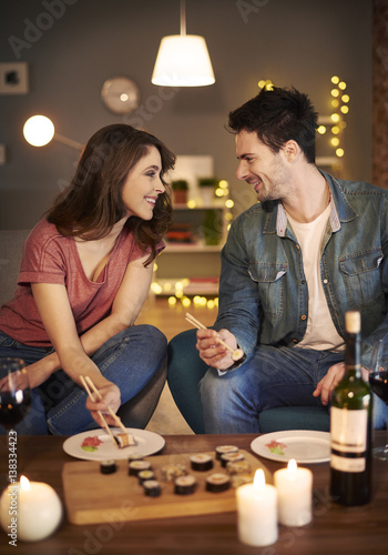 Man telling the romantic stories to his girfriend photo