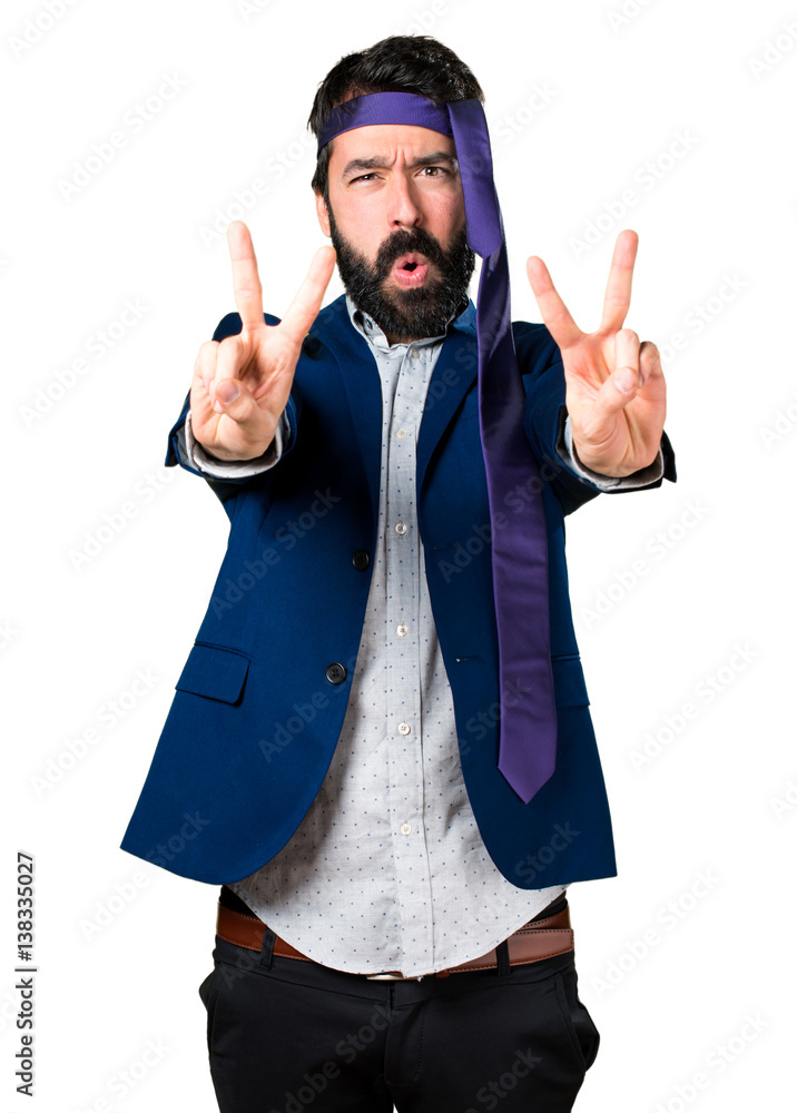 Crazy and drunk businessman making victory gesture Crazy and drunk businessman making victory gesture