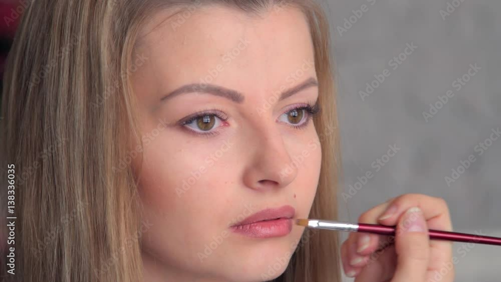 Face Makeup Making Lips Brush.
Young Mediterranean girl applying make up.
Beautiful woman putting cosmetics.
Gorgeous fashion and beauty care close up Face Makeup Making Lips Brush.
Young Mediterranean girl applying make up.
Beautiful woman putting cosmetics.
Gorgeous fashion and beauty care close up