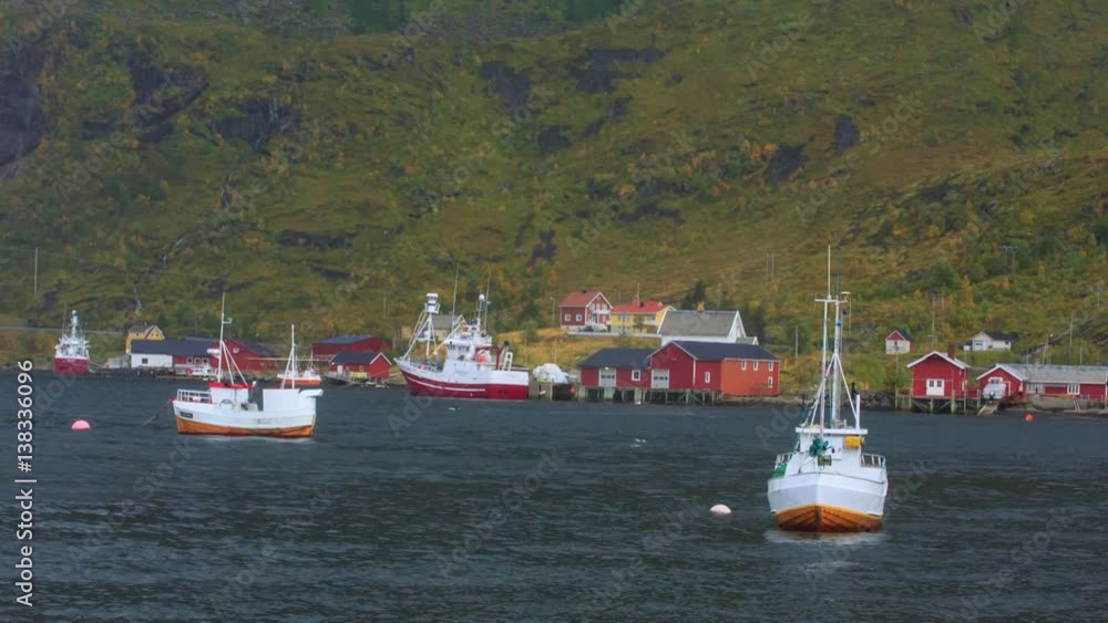 Fishing boats on strong wind in in the Gulf of Reine in Lofoten Fishing boats on strong wind in in the Gulf of Reine in Lofoten