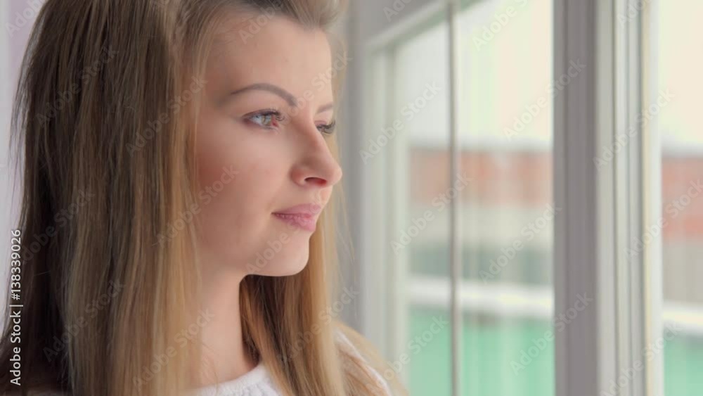 4K Attractive woman in thought looking out of a train window 4K Attractive woman in thought looking out of a train window