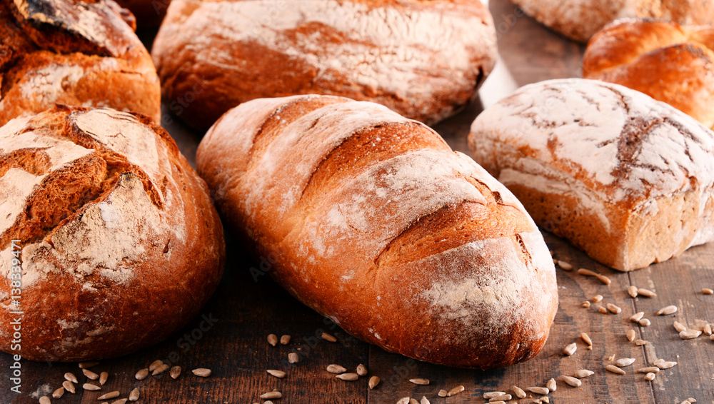 Composition with variety of baking products on wooden table Composition with variety of baking products on wooden table