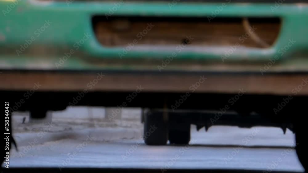 A truck with green cabin slowly up the hill A truck with green cabin slowly up the hill