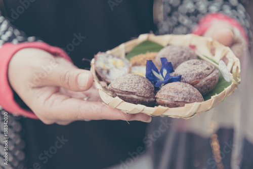 female asian hand hold Thai style Sweets.