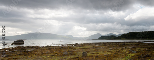 Fototapeta Naklejka Na Ścianę i Meble -  Cloudy view over Scottish Loch Linnhe with red boat