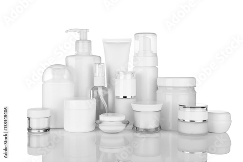 Different cosmetic bottles on white background