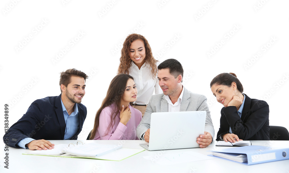 Business people sitting in front of a laptop Business people sitting in front of a laptop
