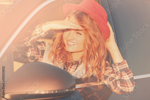 Young female driver in car ...
