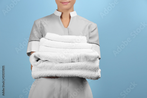 Female chambermaid holding ...