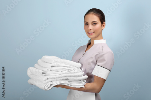 Female chambermaid  holding...