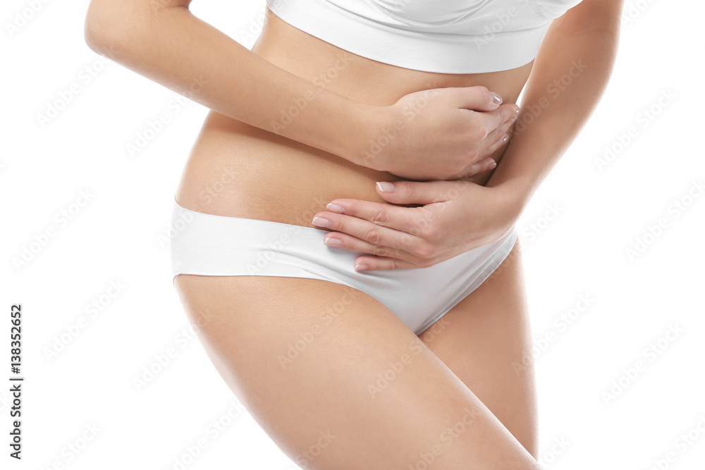 Close up view of young woman suffering from abdominal pain, on white background. Gynecology concept