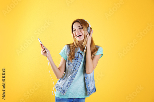 Beautiful young woman liste...