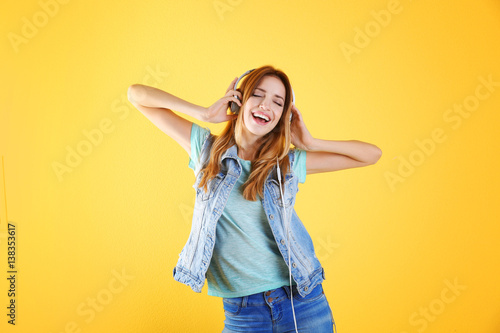 Beautiful young woman liste...