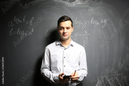 Handsome young teacher with...
